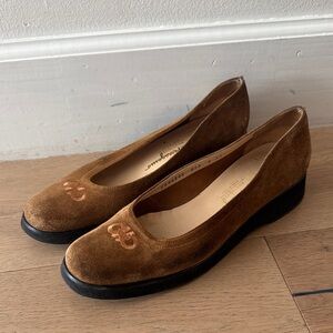 Salvatore Ferragamo suede shoes feature a gancini logo detail and a wedge hee